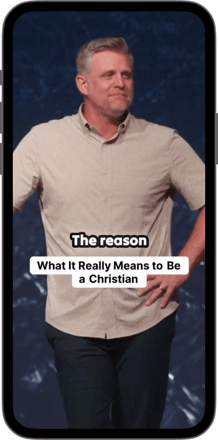 Phone displaying sermon clip with captions - 'What It Really Means to Be a Christian'